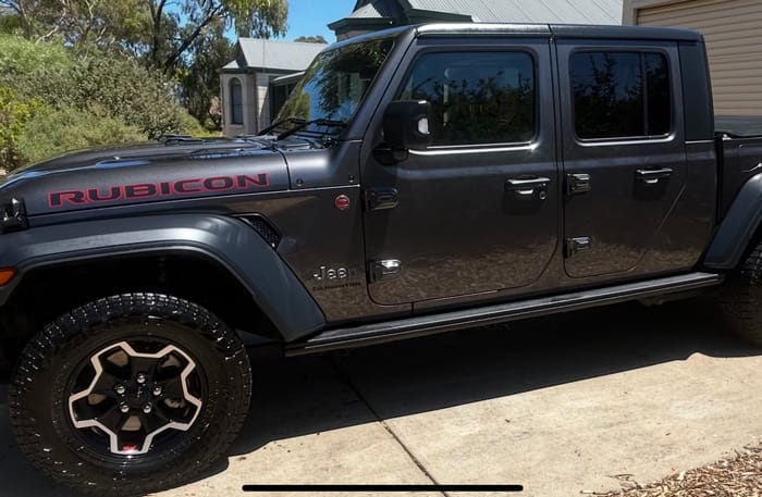 A Jeep Gladiator Rubicon detailed in the driveway
