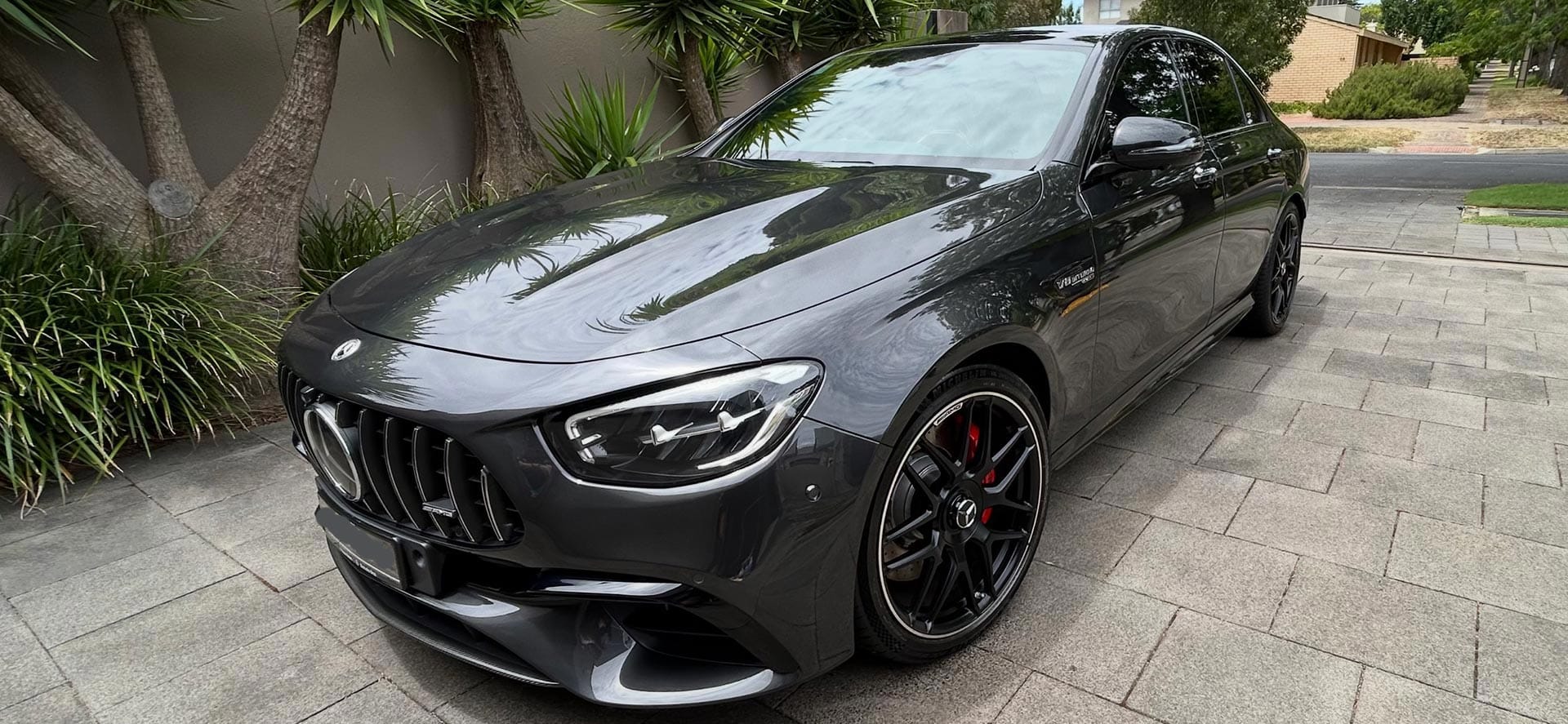 A grey Mercedes-AMG detailed to a mirror gloss on an Adelaide driveway by Phoenix Mobile Automotive Detailing